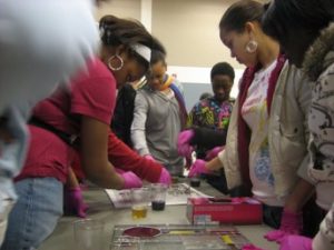 outreach visitors doing gold nanoparticle activity